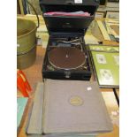 A HMV gramophone record player with a selection of 78rpm shellac records