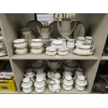 A modern Paragon Athena pattern tea dinner and breakfast service over two shelves including tea