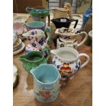 A selection of antique and later Burleigh ware, Masons and similar water and milk jugs.