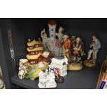 A selection of antique and later Staffordshire flat back figures including model house, spill vase