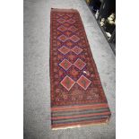 An early 20th century North West Persia Bokhara carpet runner hand woven