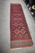 An early 20th century North West Persia Bokhara carpet runner hand woven