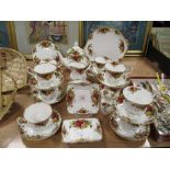 A collection of Royal Albert 'Old Country Roses' cups and saucers, tea pot,sugar, creamer, cake