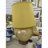 A mid century middle eastern table lamp made from Cammel