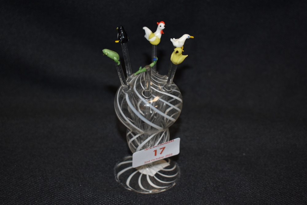 A set or early 20th century lampwork cocktail sticks or drink stirrer with animal figure tops in