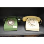 Two GPO telephone sets in green and cream