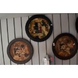 Four mid century oriental style Bretby wall plaques.