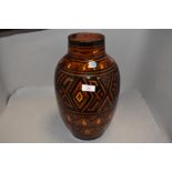 A Moroccan vase of Safi decoration with brown, yellow and black glaze