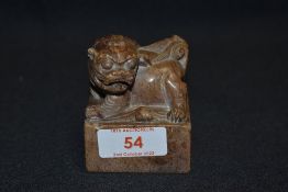 A Chinese soap stone seal carved with a Dog of Fo and seal mark to base or matrix