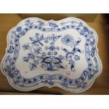 A porcelain serving tray bearing the Meissen mark having scalloped design with a traditional delft