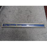 A composite house sign 'The Manor House'.