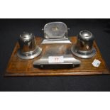 An Edwardian oak and chrome desktop stationary set with perpetual date calendar