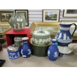 A collection of antique and later Wedgwood Jasperwares including sage green jug and container