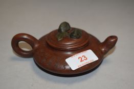A fine early 20th century Chinese Zisha Yixing teapot or sake vessel with double carp handle and
