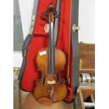 A traditional violin having 14inch two piece back, unlabelled with similar bow and hard case