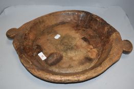 An antique Beech wood bread board or grain bowl with handles