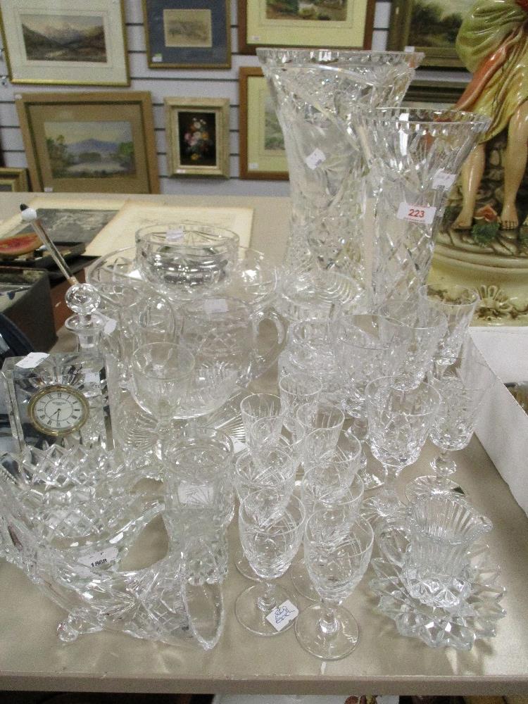 A selection of 20th century clear cut crystal glass wares including a Waterford clock, Sherry