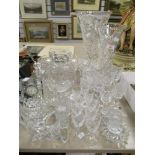 A selection of 20th century clear cut crystal glass wares including a Waterford clock, Sherry