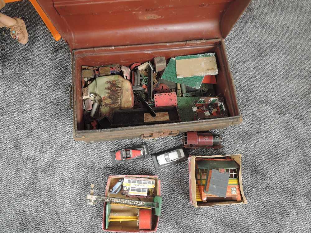 A tin trunk containing vintage Meccano and Hornby 0 Gauge, diecasts etc