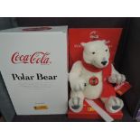 A Limited Edition Steiff Bear, Polar Bear Coca Cola 670336 5675/10000, white tag, display stand,