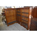 A Victorian corner bookcase, with adjustable material edged shelving, 132CM. X145CM. and 108CM.