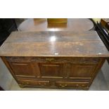 An century oak mule chest of traditional design with later carved frieze over three panels and two