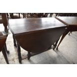 A 20th century reproduction oak gate leg table of traditional design. 74 CCM. X106CM. Sold with a