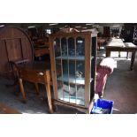 An early 20th century glazed mahogany display cabinet (af) sold alongside a 20th century mahogany