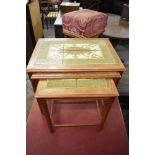 A nest of three 1960s Danish oak tile top tables, each with moulded edge detail over chamfered