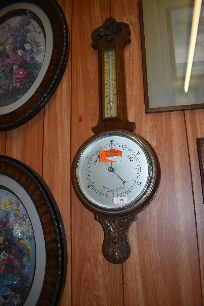 A 1940s carved oak banjo barometer. 80CM