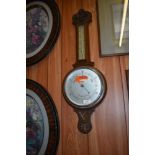 A 1940s carved oak banjo barometer. 80CM