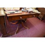 A Victorian mahogany pedestal side table, the rounded rectangular top over two drawers and turned