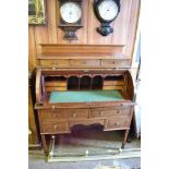 An Edwardian banded mahogany cylinder bureau, the raised superstructure with three short drawers