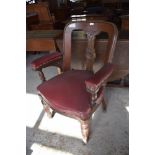 Near pair of late Victorian substantial armchairs. upholstered in Burgundy leatherette material