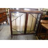 A 1930s glazed mahogany display cabinet. 126CM. X119CM.