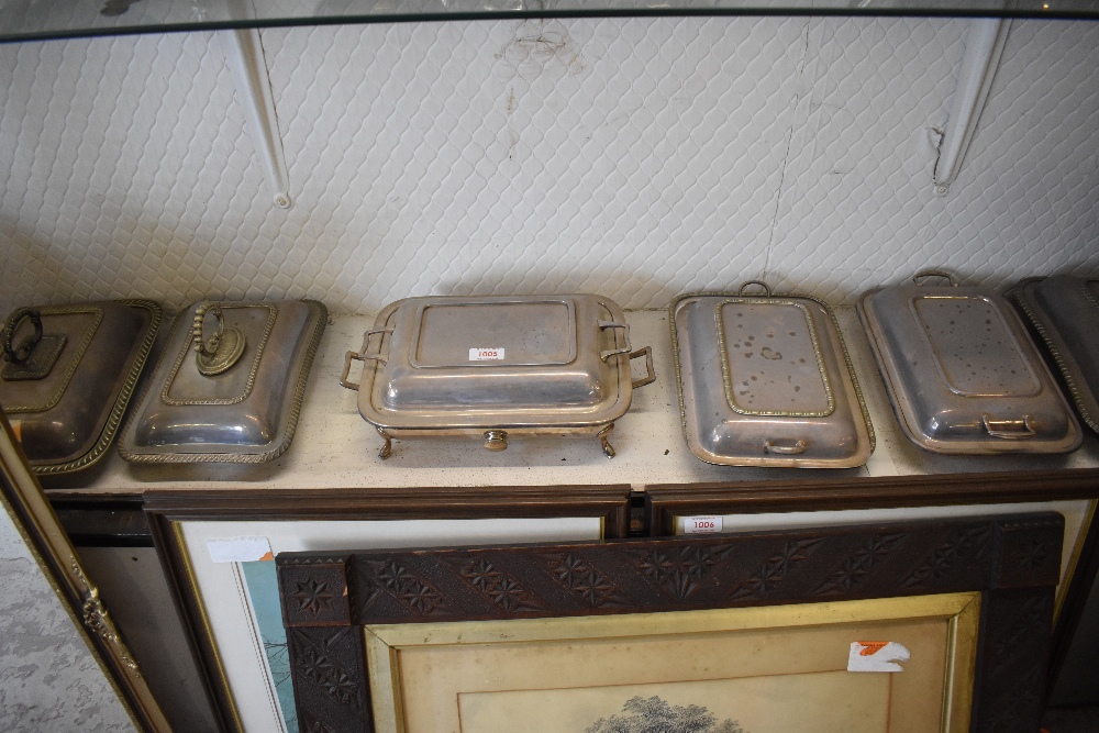 A group of nine silver plated entree dishes and a small selection of pewter and other plated wares.