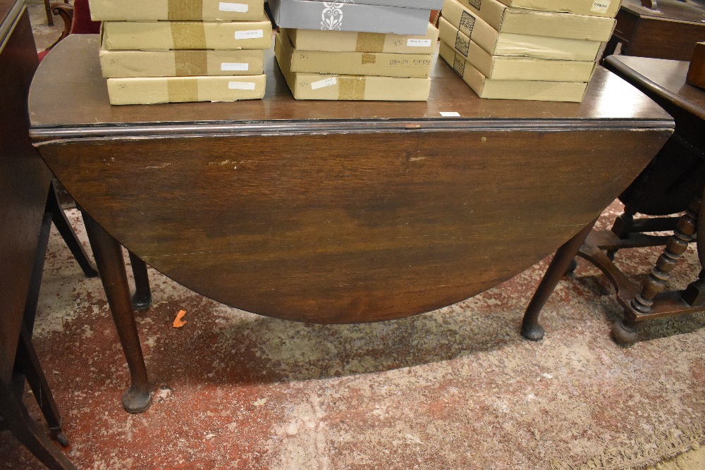 1920s mahogany dropleaf table with demilune leaves, turned supports and pad feet. 72CM. X. 129CM