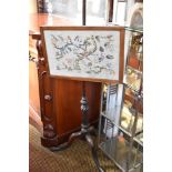 A 19th century Mahogany pole screen, the embroidered screen raised on mahogany stem, with fluted and