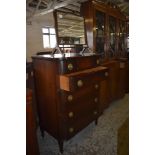 A reproduction bowfronted mahogany chest of five drawers, the upper drawer with central inlaid