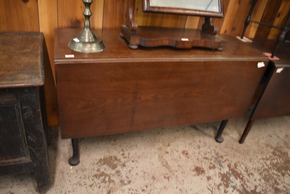 A 19th century mahogany drop leaf table of oblong form. 72CM X 120CM.