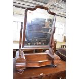 A Victorian figured mahogany swing dressing mirror with central lift up section. 91CM.