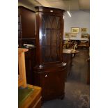 A reproduction mahogany glazed double corner cupboard. 179CM.