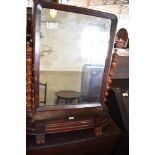 A Victorian mahogany swing dressing mirror with barley twist uprights. 88CM.