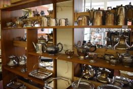 A large quantity of silver plated wares to include three piece tea sets, baskets, entree dishes, egg