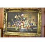 A large 20th century oil on canvas, still life study of fruit, within an ornate moulded gilt