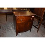 A 19th century mahogany chest form commode, the bow fronted top lifting to reveal the now vacant