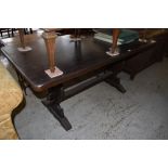 A 20th century stained oak refectory type table. 74CM. X. 156CM. Table covers included.