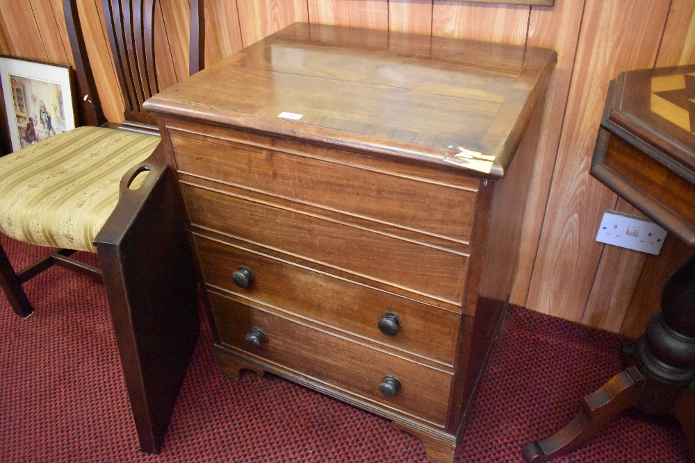 A 19th century mahogany chest commode, the rectangular banded top lifting to reveal the internal