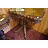 An early 19th century mahogany pedestal tea table the D shaped top with inlaid banding over a turned