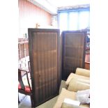 An Edwardian stained mahogany three fold room screen with material panels, each section measuring